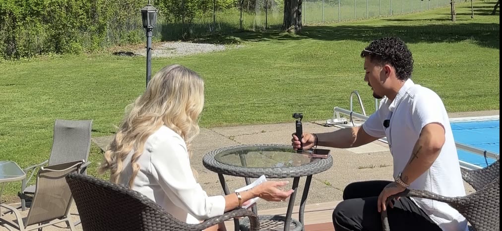 Nick coaching a client through her video before filming